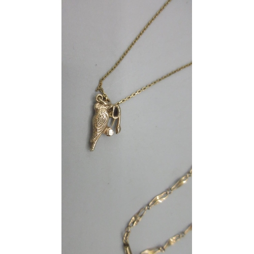 189 - Yellow metal bird and snake pendant, on 9ct yellow gold chain stamped 375 and a yellow metal chain l... 