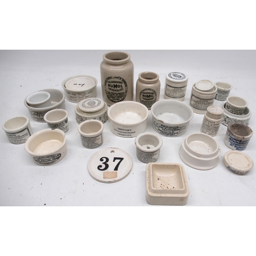 267 - Collection of ceramic cream and ointment jars and lids, including Maison Dorin, Numol, Holloway's go... 