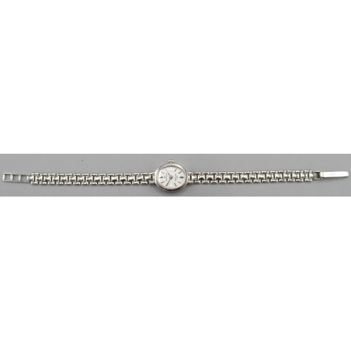 677A - WITHDRAWN Ladies Sovereign 9ct white gold quartz wristwatch on integrated bracelet, signed white dia... 