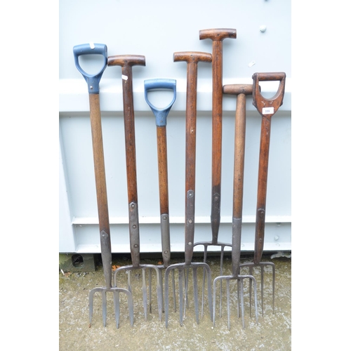 359 - Seven vintage garden forks in various styles and sizes