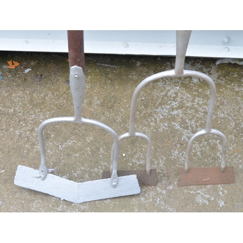 362 - Two large vintage cultivation tools