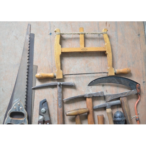 374 - Selection of vintage tools, including saws, seed drillers, edging tools etc.