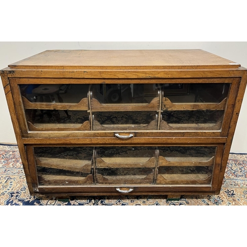 106 - Early 20th century haberdashery cabinet, twelve drawers with two glazed doors, W107cm D53cm H81cm