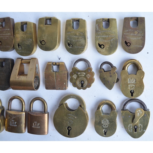 387 - Thirty small and medium sized mostly vintage brass and steel padlocks, no keys