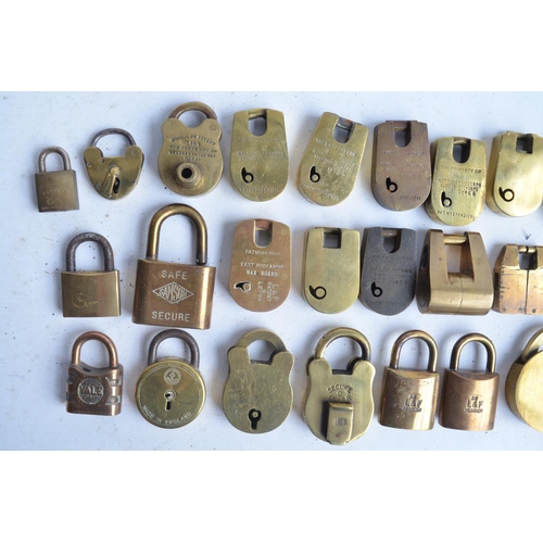 387 - Thirty small and medium sized mostly vintage brass and steel padlocks, no keys