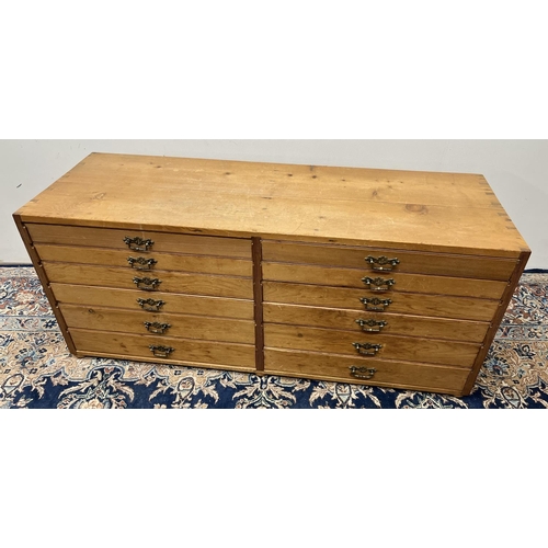 1133 - 20th century pitch pine bank of twelve drawers, W120cm D40cm H52cm