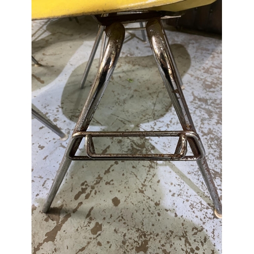 618 - Six vintage Eames for Herman Miller yellow fibreglass and chrome plated DSS stacking chairs, moulded... 