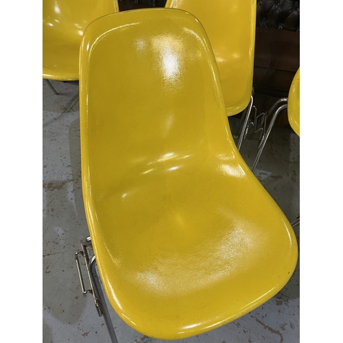 619 - Six vintage Eames for Herman Miller yellow fibreglass and chrome plated DSS stacking chairs, moulded... 