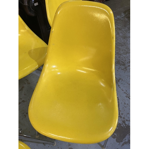 619 - Six vintage Eames for Herman Miller yellow fibreglass and chrome plated DSS stacking chairs, moulded... 