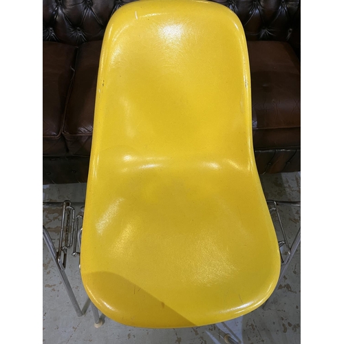 619 - Six vintage Eames for Herman Miller yellow fibreglass and chrome plated DSS stacking chairs, moulded... 