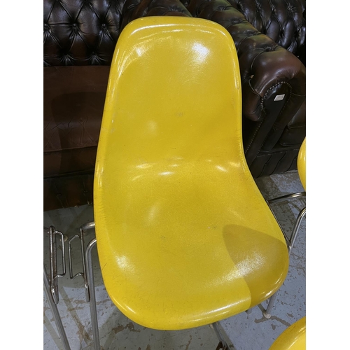 619 - Six vintage Eames for Herman Miller yellow fibreglass and chrome plated DSS stacking chairs, moulded... 