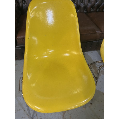 620 - Six vintage Eames for Herman Miller yellow fibreglass and chrome plated DSS stacking chairs, moulded... 