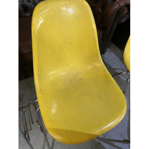 620 - Six vintage Eames for Herman Miller yellow fibreglass and chrome plated DSS stacking chairs, moulded... 