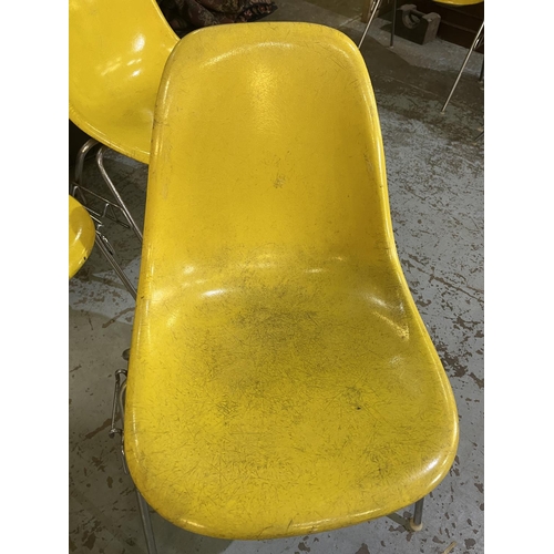 620 - Six vintage Eames for Herman Miller yellow fibreglass and chrome plated DSS stacking chairs, moulded... 