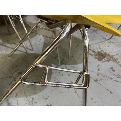 620 - Six vintage Eames for Herman Miller yellow fibreglass and chrome plated DSS stacking chairs, moulded... 