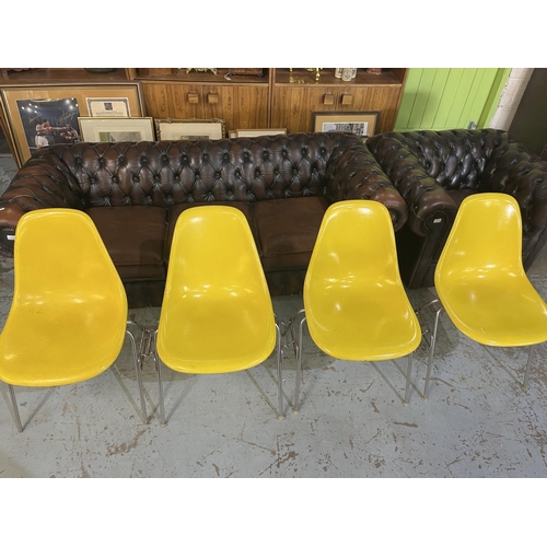 621 - Four vintage Eames for Herman Miller yellow fibreglass and chrome plated DSS stacking chairs, moulde... 