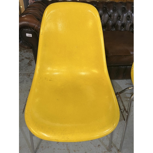 621 - Four vintage Eames for Herman Miller yellow fibreglass and chrome plated DSS stacking chairs, moulde... 