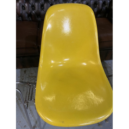 621 - Four vintage Eames for Herman Miller yellow fibreglass and chrome plated DSS stacking chairs, moulde... 