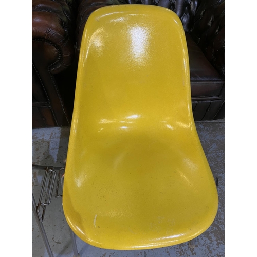 621 - Four vintage Eames for Herman Miller yellow fibreglass and chrome plated DSS stacking chairs, moulde... 