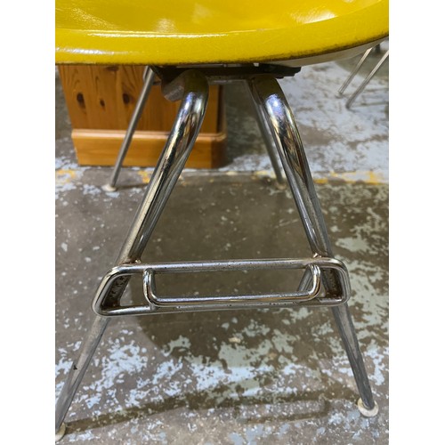 622 - Vintage Eames for Herman Miller yellow fibreglass and chrome plated DSS stacking chair, moulded mark... 