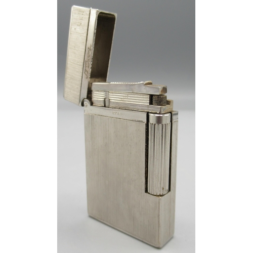 1161 - S.T. Dupont, Paris - chrome plated butane cigarette lighter, vertically brushed body, base signed no... 