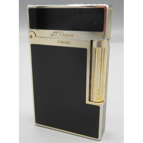 1162 - S.T. Dupont, Paris - gold plated butane cigarette lighter, black enamelled body, base signed no. 4FK... 