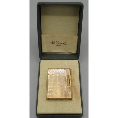 1163 - S.T. Dupont, Paris - gold plated butane cigarette lighter, vertically engraved and patterned body, b... 