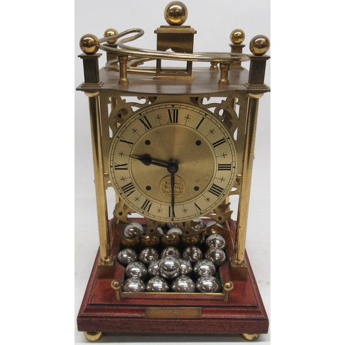 1115 - Harding & Bazeley, Cheltenham - Spherical Weight Clock, ltd.ed no.928, brass openwork frame with cir... 