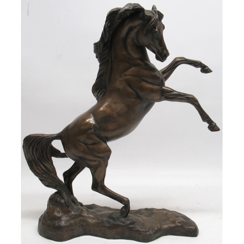 1180 - Boehm of Malvern - 'Arab Stallion Rearing' patinated bronze model on a shaped naturalistic base, ltd... 