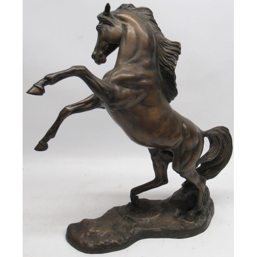 1180 - Boehm of Malvern - 'Arab Stallion Rearing' patinated bronze model on a shaped naturalistic base, ltd... 