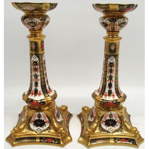 1128 - Pair of Royal Crown Derby Imari candlesticks, pattern 1128, shaped circular sconces and tapered colu... 