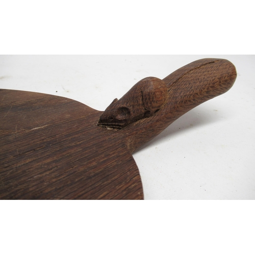 1347 - Robert Mouseman Thompson of Kilburn - an oak oval cheese board, curved handle carved with signature ... 