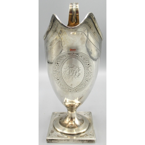 1045 - George 111 silver helmet shaped pedestal cream jug engraved with initials in floral cartouche, with ... 