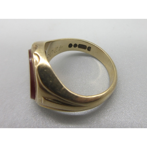 1015 - 9ct yellow gold signet ring, the oval face set with polished carnelian, M1/2, 5.86g