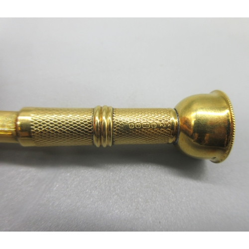 1008 - 18ct yellow gold cigar piercer with engine turned detail, with engraved initials C.L.P.M to rim, 9.5... 