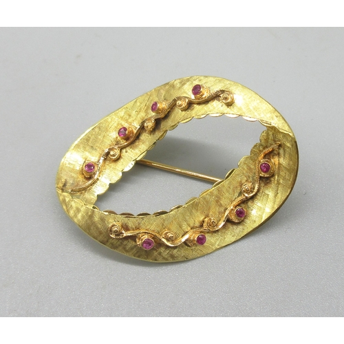 1006 - 18ct yellow gold oval ribbon brooch with scroll detail set with round cut rubies, stamped 750, W4.3c... 