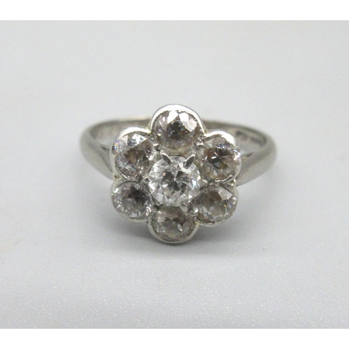 1003 - 18ct white gold diamond cluster ring, the seven old cut diamonds set in flower shaped cluster, in ru... 