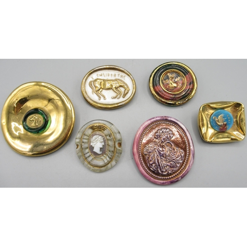 1145 - Orplid (Bimini) Glassworks - five glass brooches and a dress clip, c1940s/1950s, centrally moulded w... 