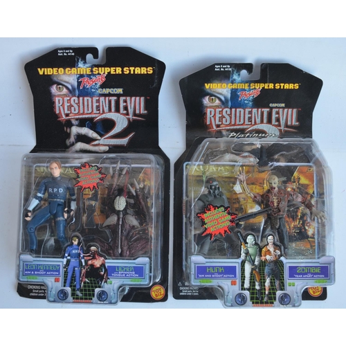 65 - Four Resident Evil action figure sets from Toy Biz to include William Birkin with Sherry, Tyrant/Mr.... 