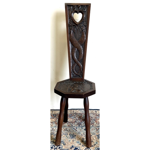 1326 - Victorian Welsh mahogany spinning chair, back carved with entwined sea beasts and dated 1893, octago... 