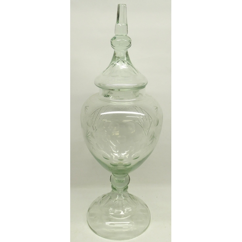 1135 - Large late 19th century clear glass Chemists jar and cover with faceted finial, urn body with etched... 