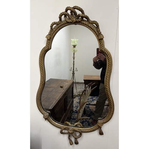 1314 - Late 19th century carved giltwood cartouche-shaped wall mirror, shaped plate within an entwined rope... 