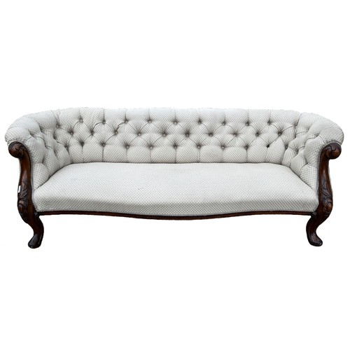 1315 - Victorian mahogany framed serpentine front sofa, deep buttoned back and outscrolled arms on cabochon... 