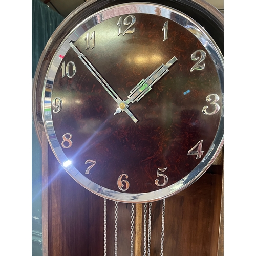 1117 - Art Deco walnut longcase clock, 15in circular dial with applied chrome Arabic numerals and pierced a... 