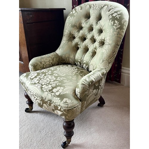 1321 - Victorian Nursing chair, buttoned back, low arms and serpentine seat on turned supports with brass s... 