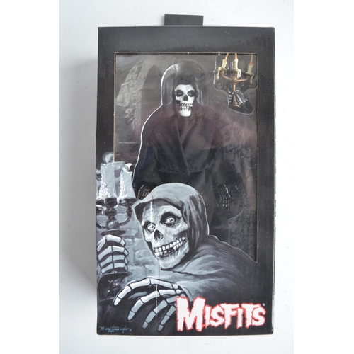 68 - Three boxed Misfits 8