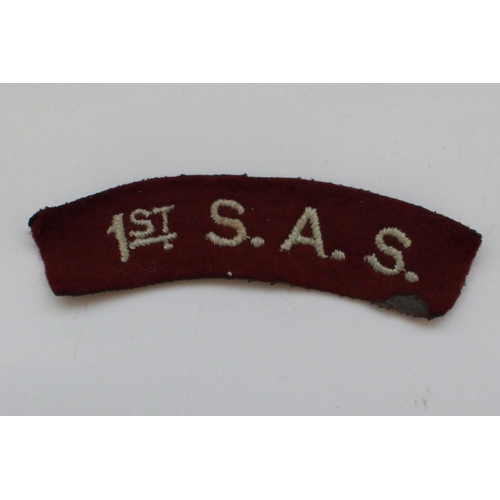 1220 - Large collection of military metal and cloth badges. 1st S.A.S Shoulder Title, R.A.F. Pilots Wings, ... 