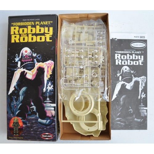 122 - Five science fiction themed plastic model kits to include Polar Lights Forbidden Planet plastic mode... 