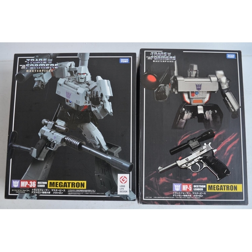 157 - Two large Takara Tomy Transformers Masterpiece models (both gun mode) to include MP-5 Destron Leader... 