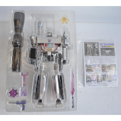 157 - Two large Takara Tomy Transformers Masterpiece models (both gun mode) to include MP-5 Destron Leader... 